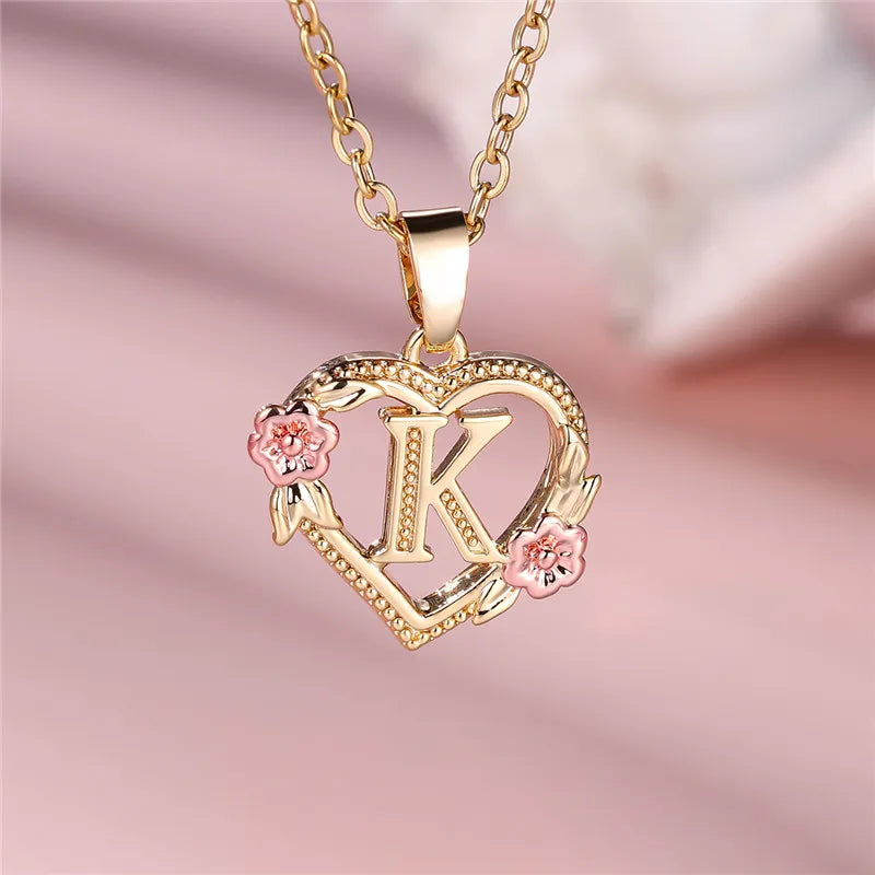 Necklace with heart and flowers initial pendant k
