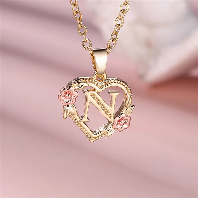 Necklace with heart and flowers initial pendant n