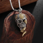 Necklace with symbolic skull and snake pendant