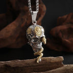 Necklace with symbolic skull and snake pendant