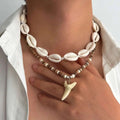 2er-Set Boho-Halsketten mit Muscheln und weißem Hai-Zahn-Anhänger