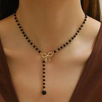 Collier de Perles avec Pendentif Noeud noir