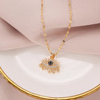 Collier de protection avec pendentif oeil bleu rayonnant