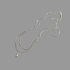 Kaheosaline kaelakee tilga kujulise ripatsiga