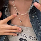 Kaheosaline kaelakee tilga kujulise ripatsiga