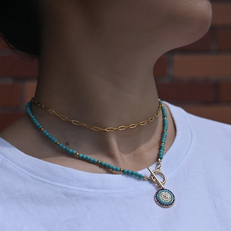 Collier en perles de couleur et pendentif de protection oeil bleu oeil bleu rond