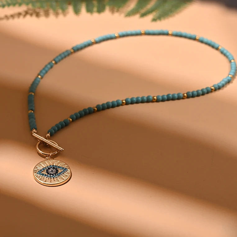 Collier en perles de couleur et pendentif de protection oeil bleu oeil bleu