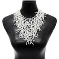 Ketting en borstplaat-hanger koraal wit
