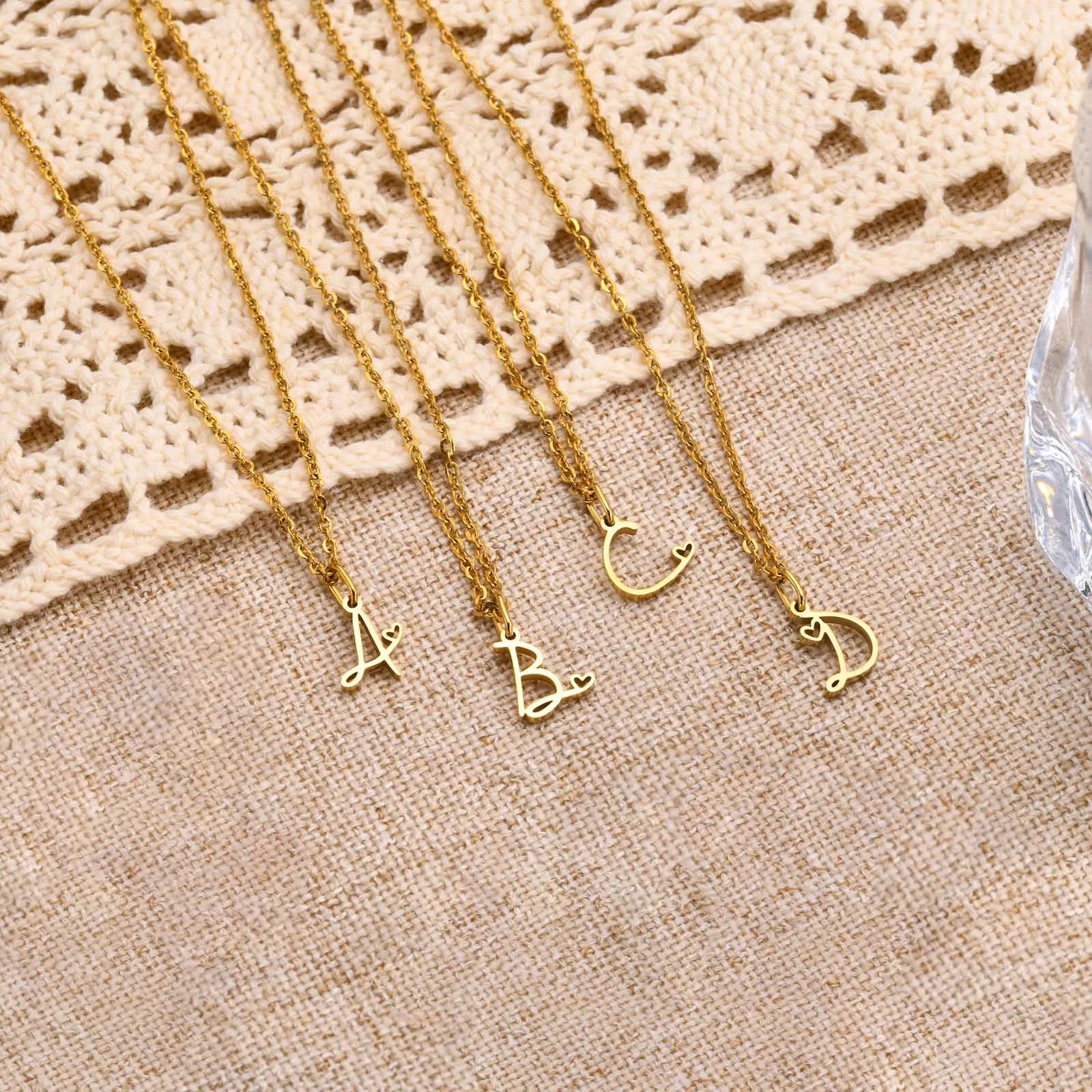Women's necklace with initial letter and heart pendant