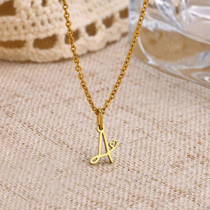 Women's necklace with initial letter and heart pendant 