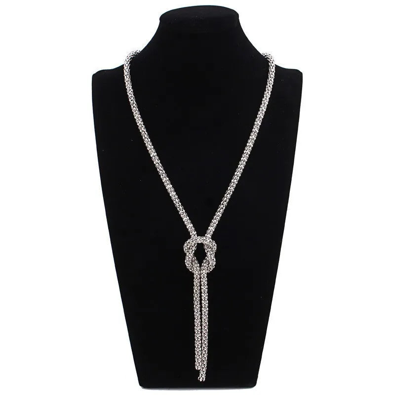 Lange ketting met knoop-hanger in zilver