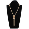 Lange ketting met knoop-hanger in goud