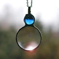 Collana con lente d'ingrandimento 