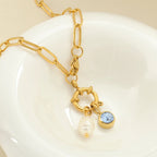 Link chain necklace with pearl pendant and April birthstone