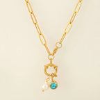 Link chain necklace with pearl pendant and December birthstone