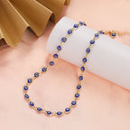 Collier ras de cou orné de multiples pendentifs oeil bleu bleu foncé