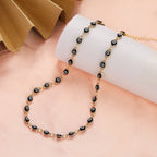 Collier ras de cou orné de multiples pendentifs oeil bleu noir