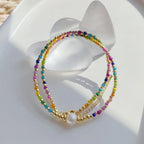 Collier ras de cou avec pendentif arc-en-ciel et perles