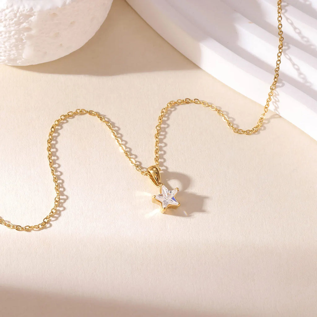 Gold choker necklace with star pendant pavé-set with zirconia
