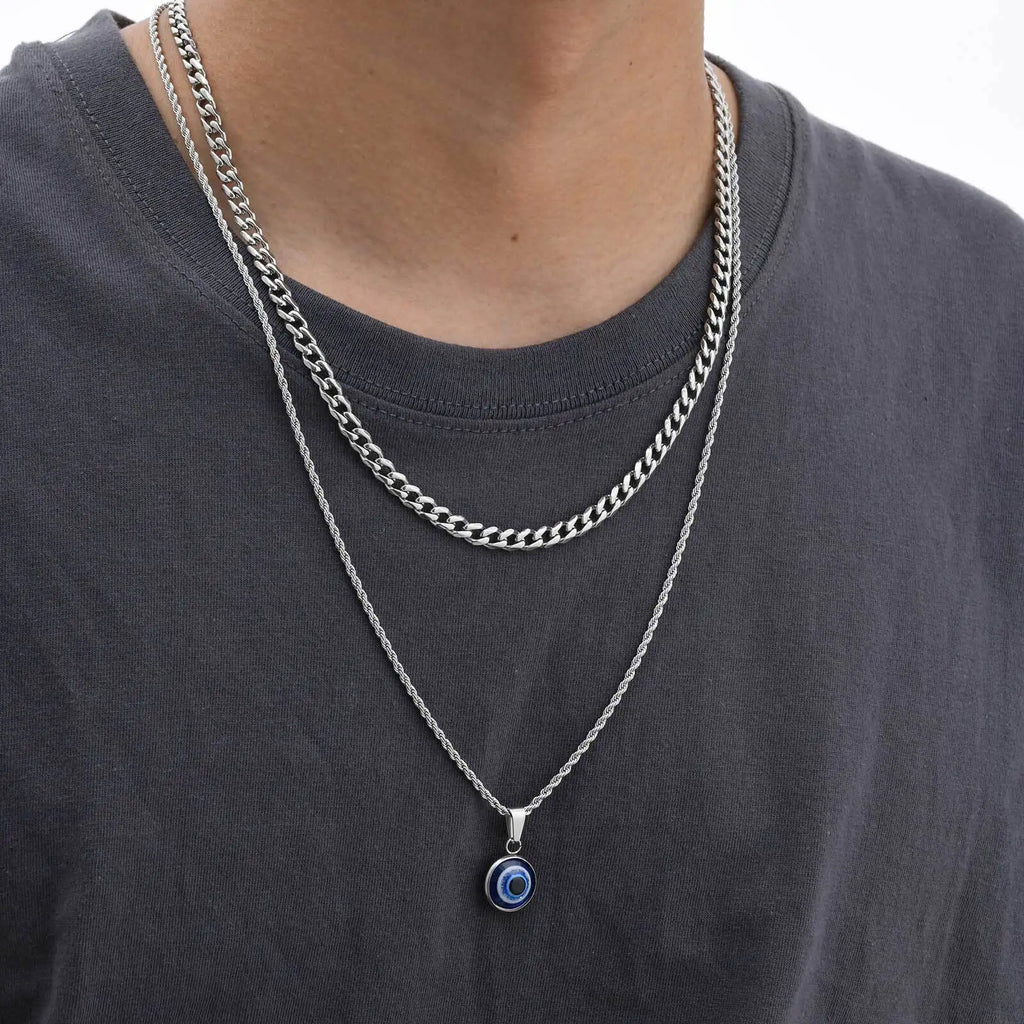 Collier torsadé avec pendentif oeil bleu discret argent