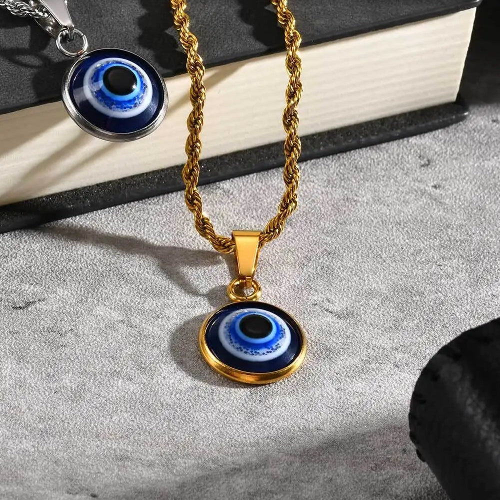 Collier torsadé avec pendentif oeil bleu discret or