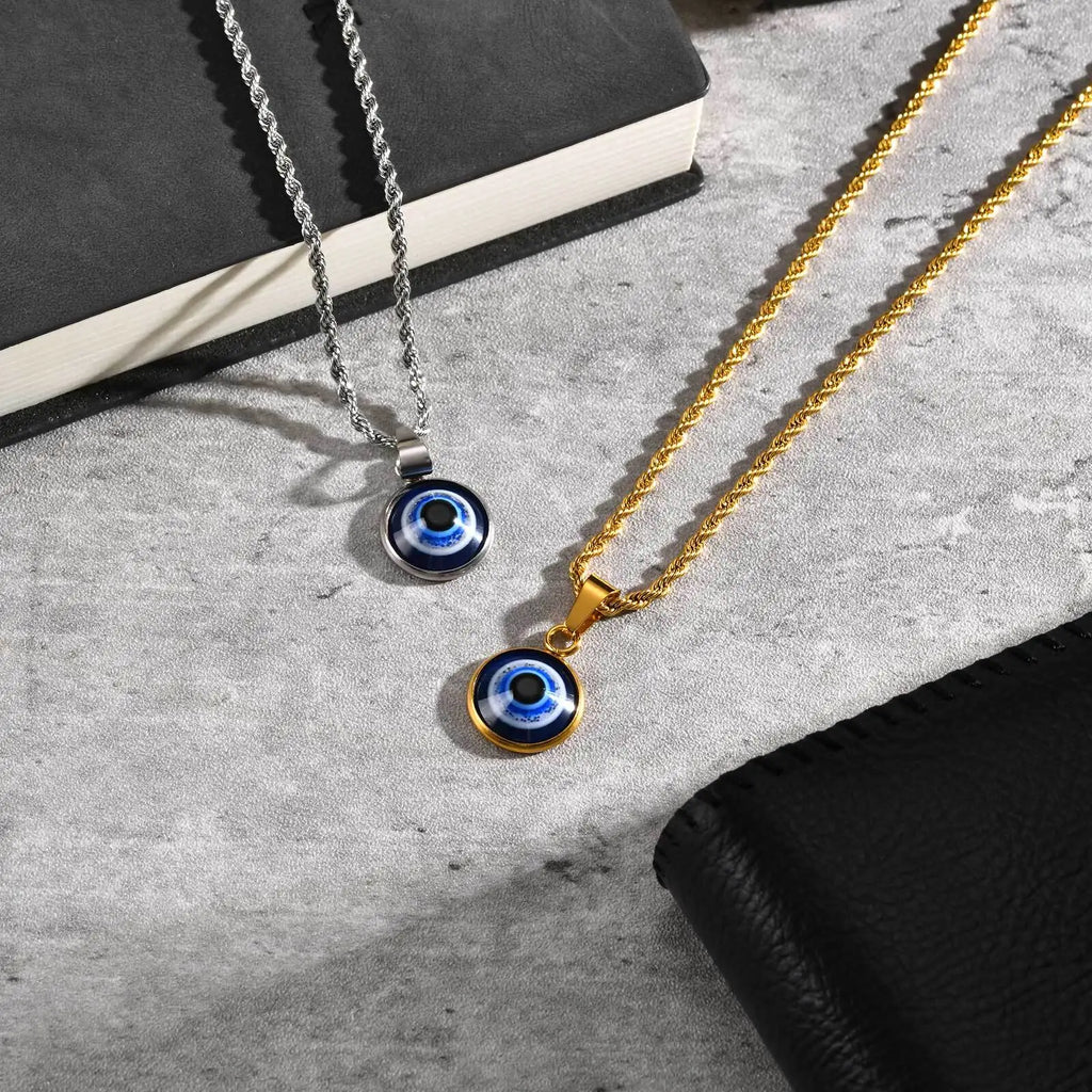 Collier torsadé avec pendentif oeil bleu discret or