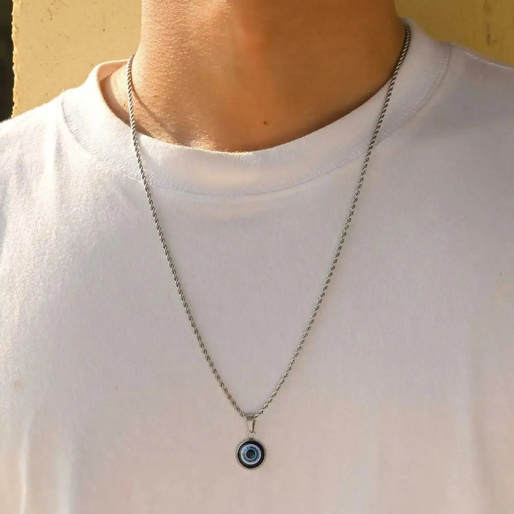Collier torsadé avec pendentif oeil bleu discret argent