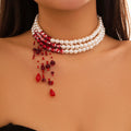 Collana a triplo giro con ciondolo a cascata di perle